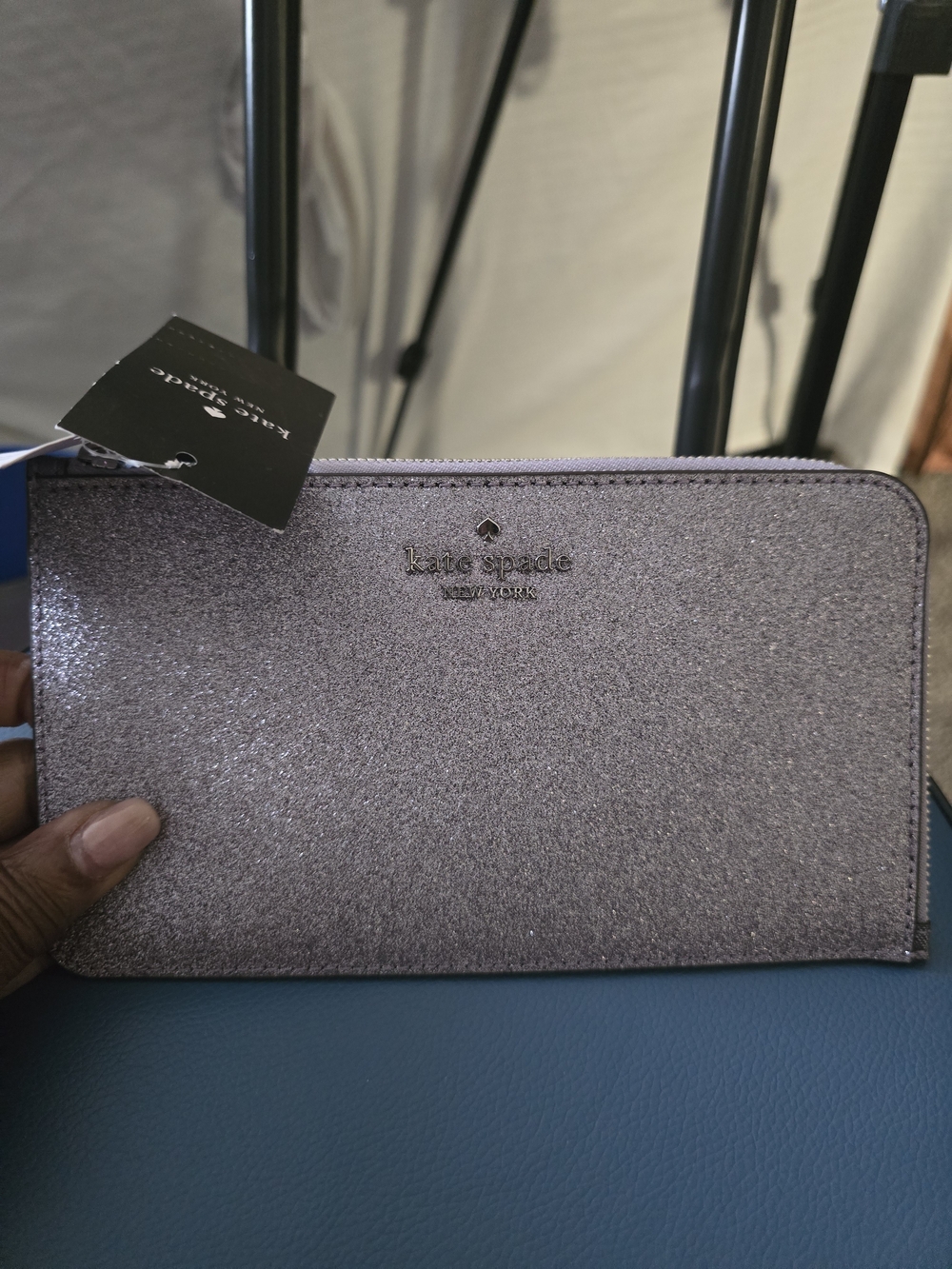 kate spade glitter zip wallet in lavender pink with gold logo